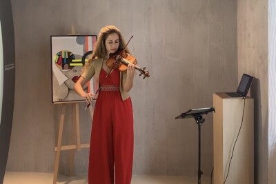 Laura playing in Biogena Store