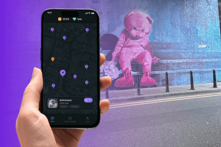 Hand mit Handy - Streetart Tour App