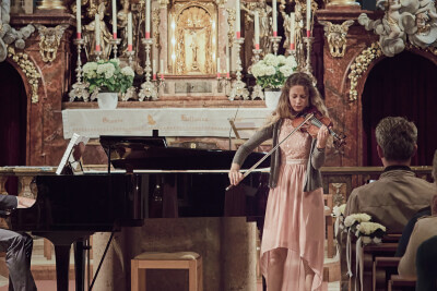 Laura playing a concert in a church